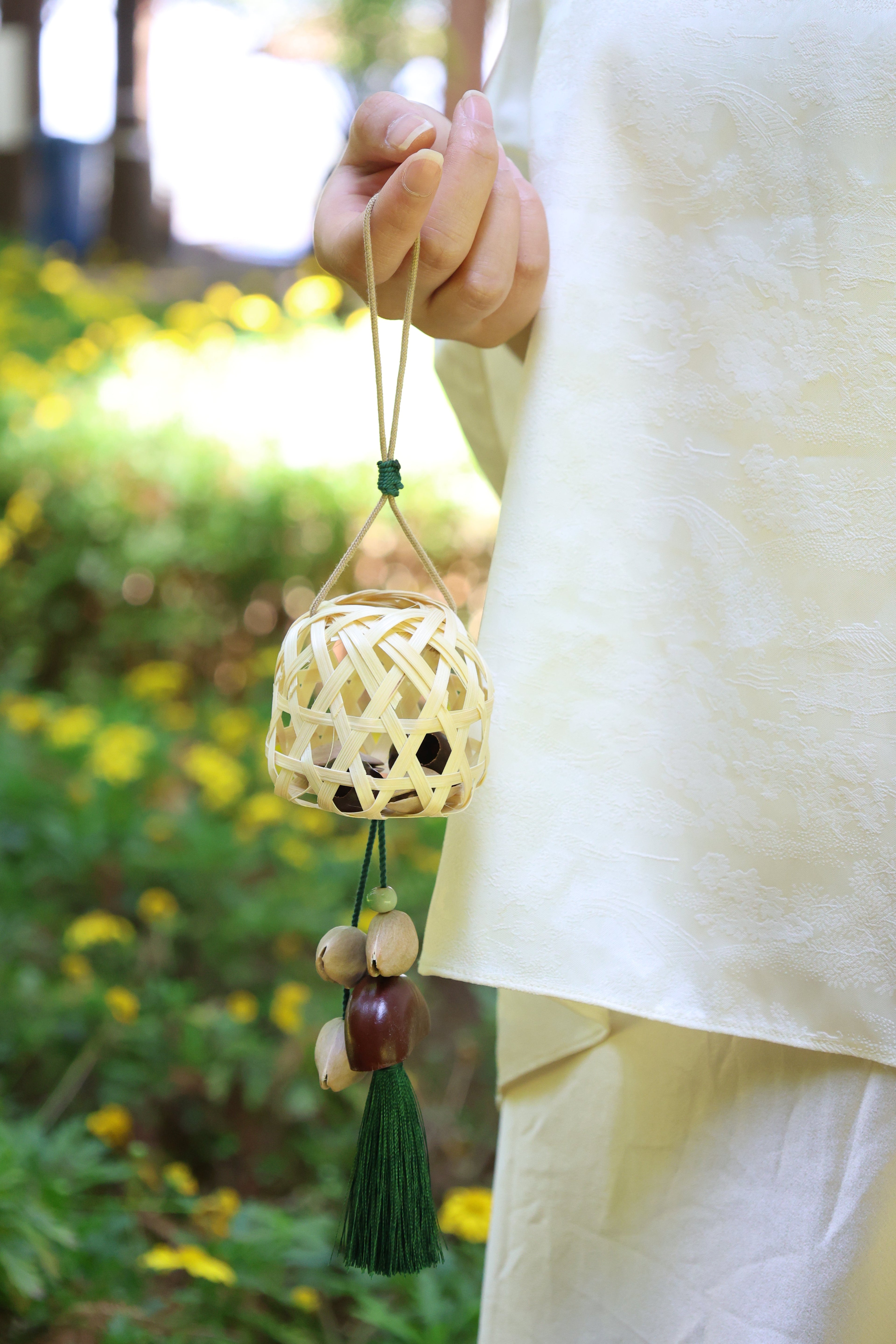 "The Bamboo Lantern" - Hand-Woven Cage Charm with Seed Bells & Emerald Tassel
