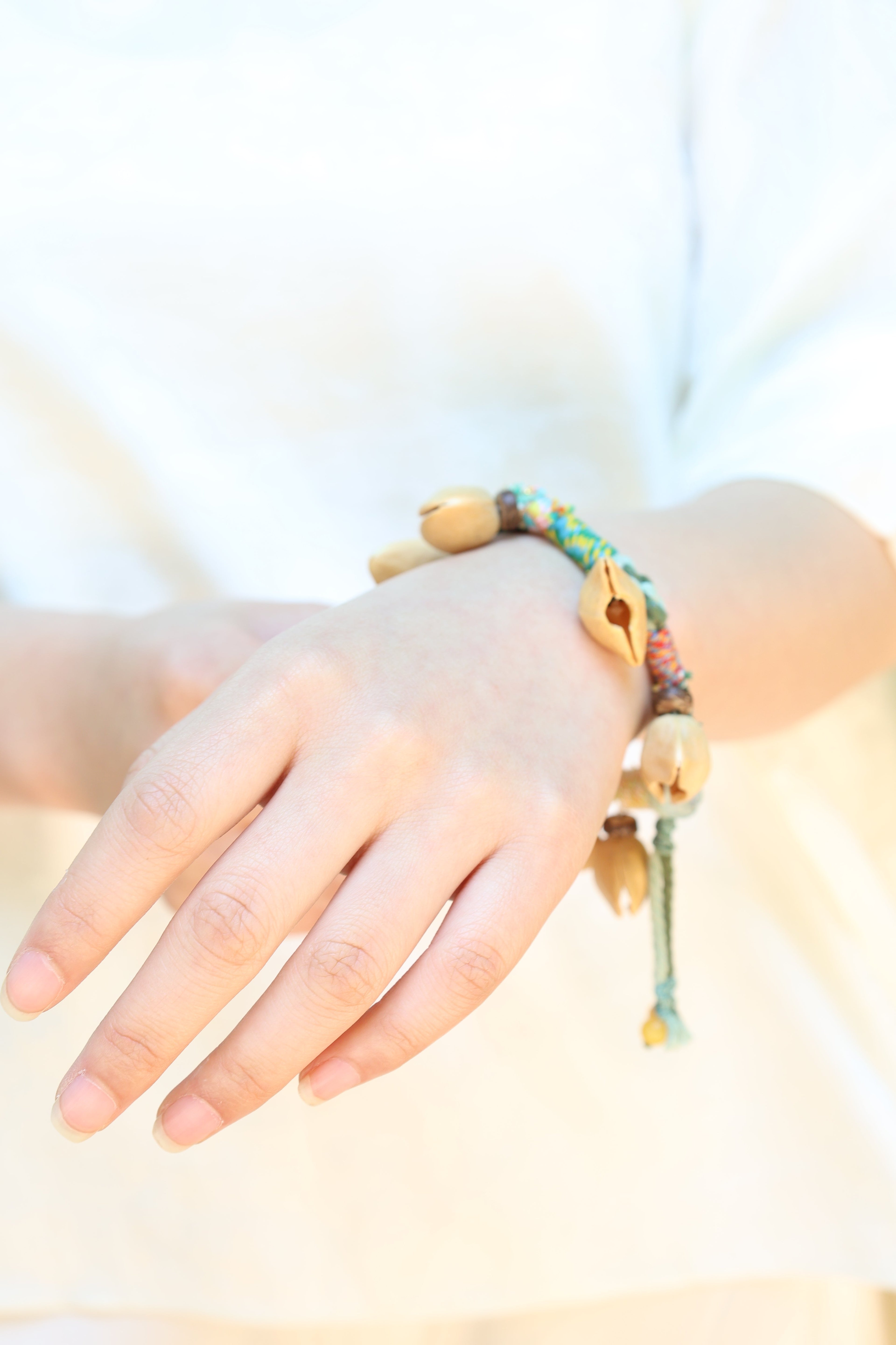 "The Happy Pistachio" - Hand-Braided Natural Shell Bracelet with Colorful Cord
