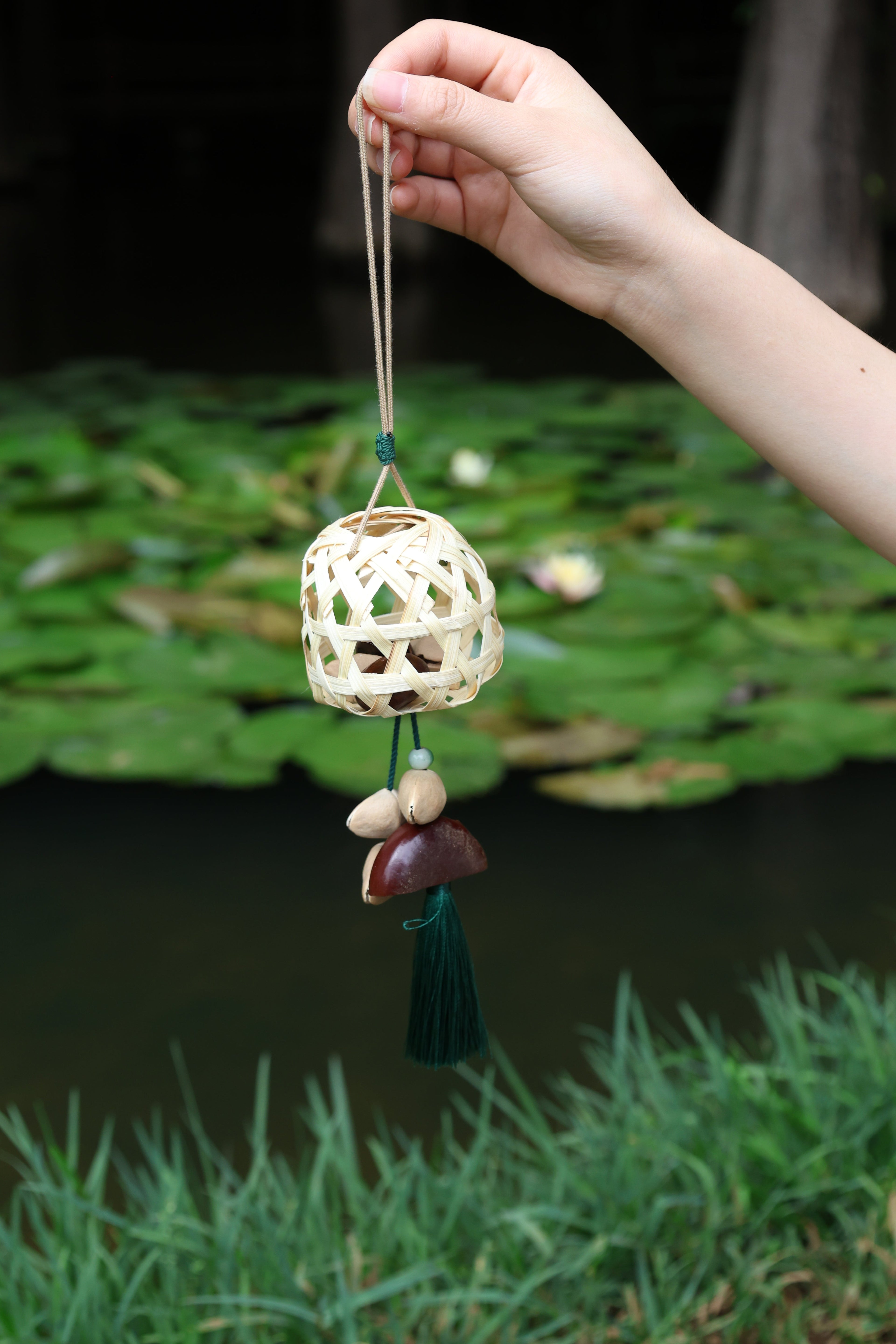 "The Bamboo Lantern" - Hand-Woven Cage Charm with Seed Bells & Emerald Tassel