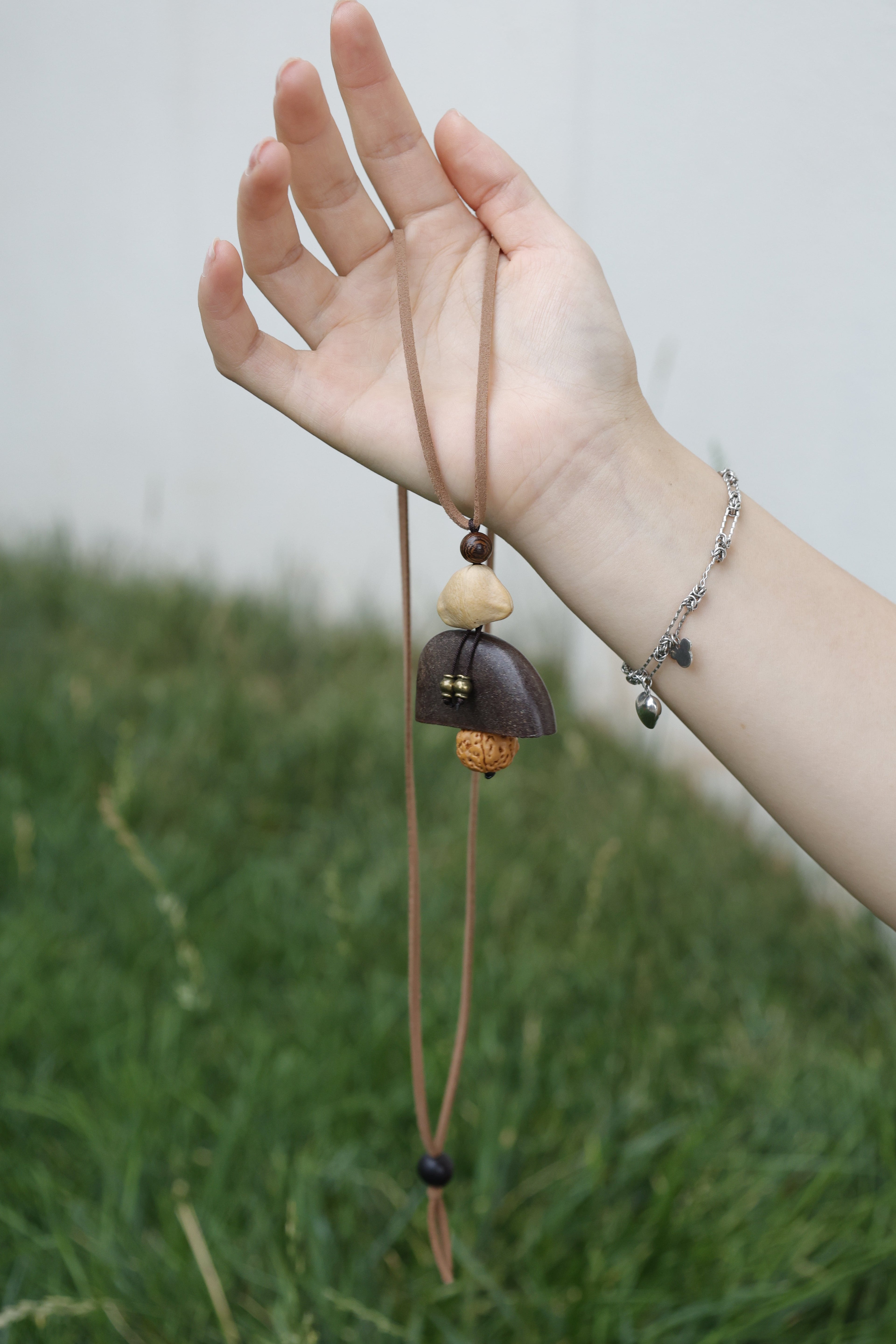 "The Meditation Bell" - Geometric Seed Pod & Rudraksha Necklace on Tan Suede