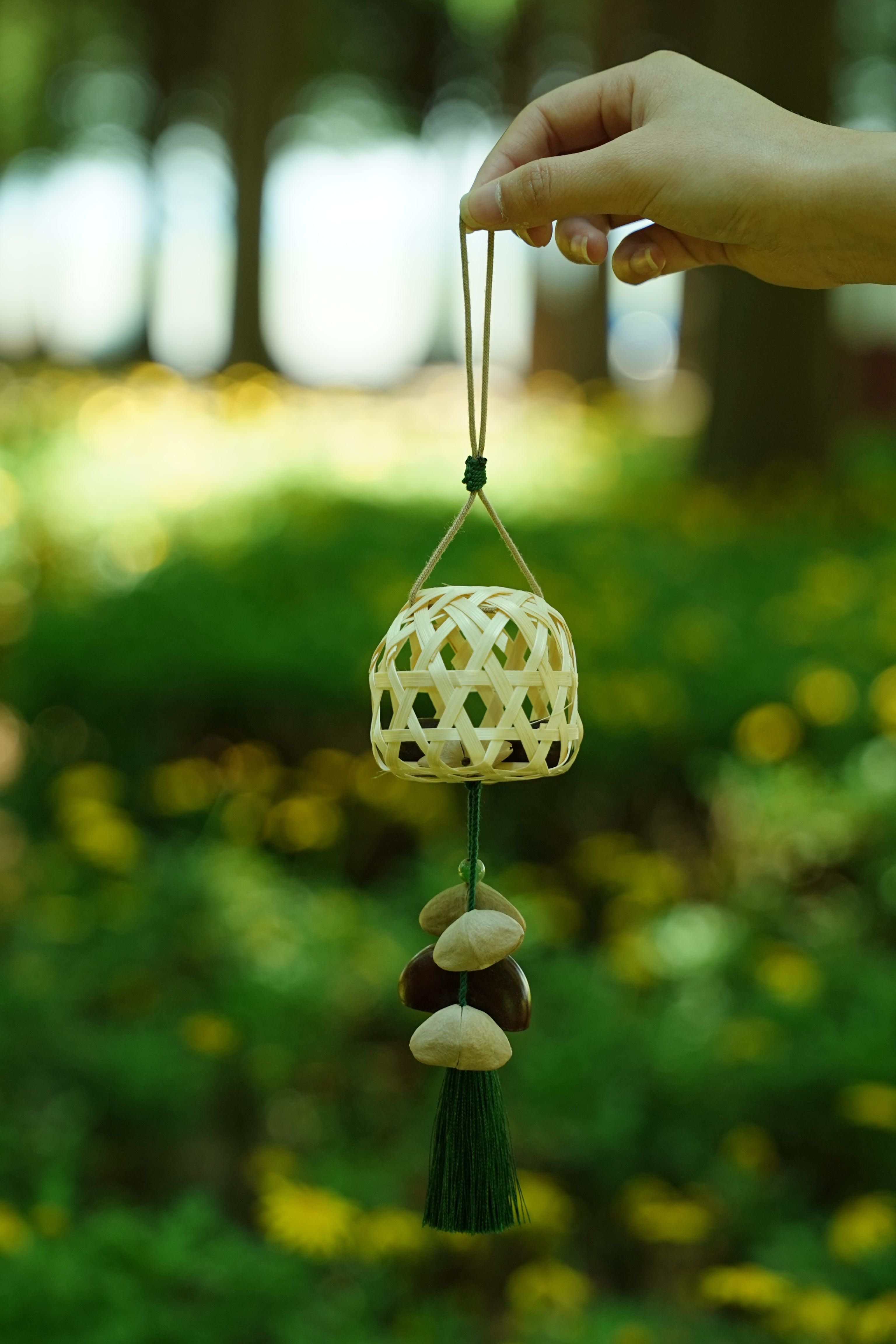 "The Bamboo Lantern" - Hand-Woven Cage Charm with Seed Bells & Emerald Tassel