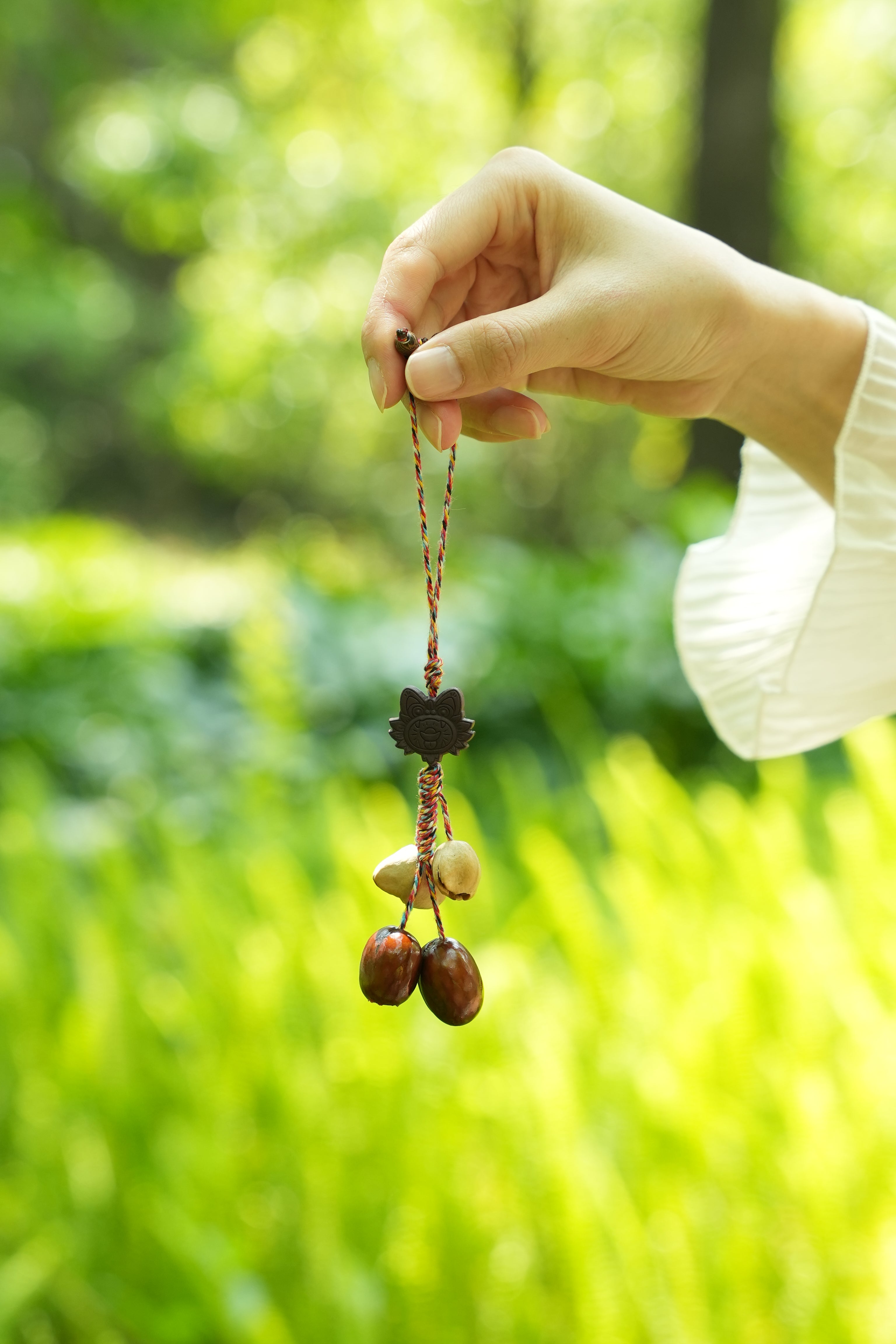 "The Brave Tiger Guardian" - Folk Art Tiger Head Charm with Colorful Cord & Seeds