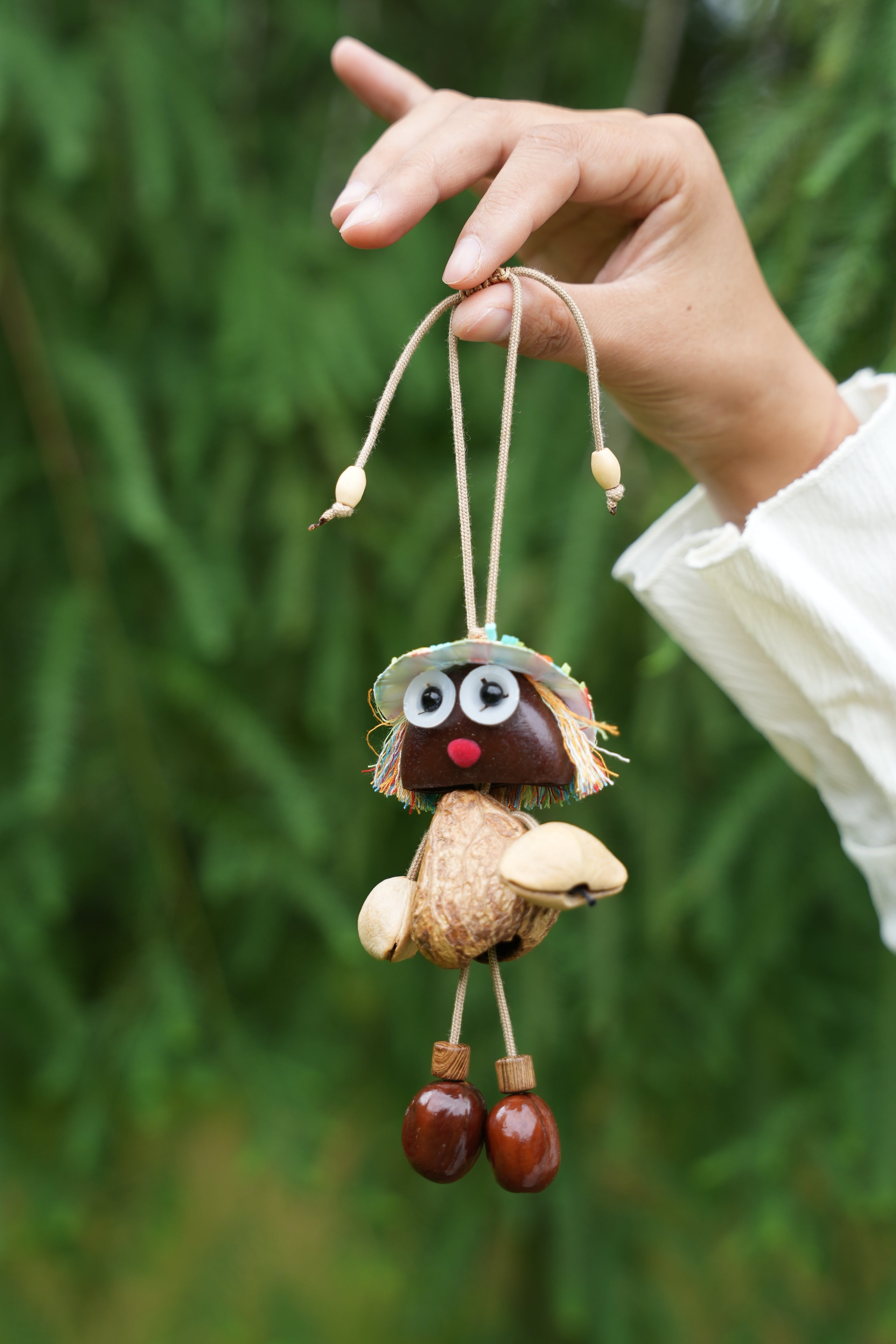"The Seed Sprite" - Handcrafted Nut Shell Doll Charm with Colorful Fringe Hair