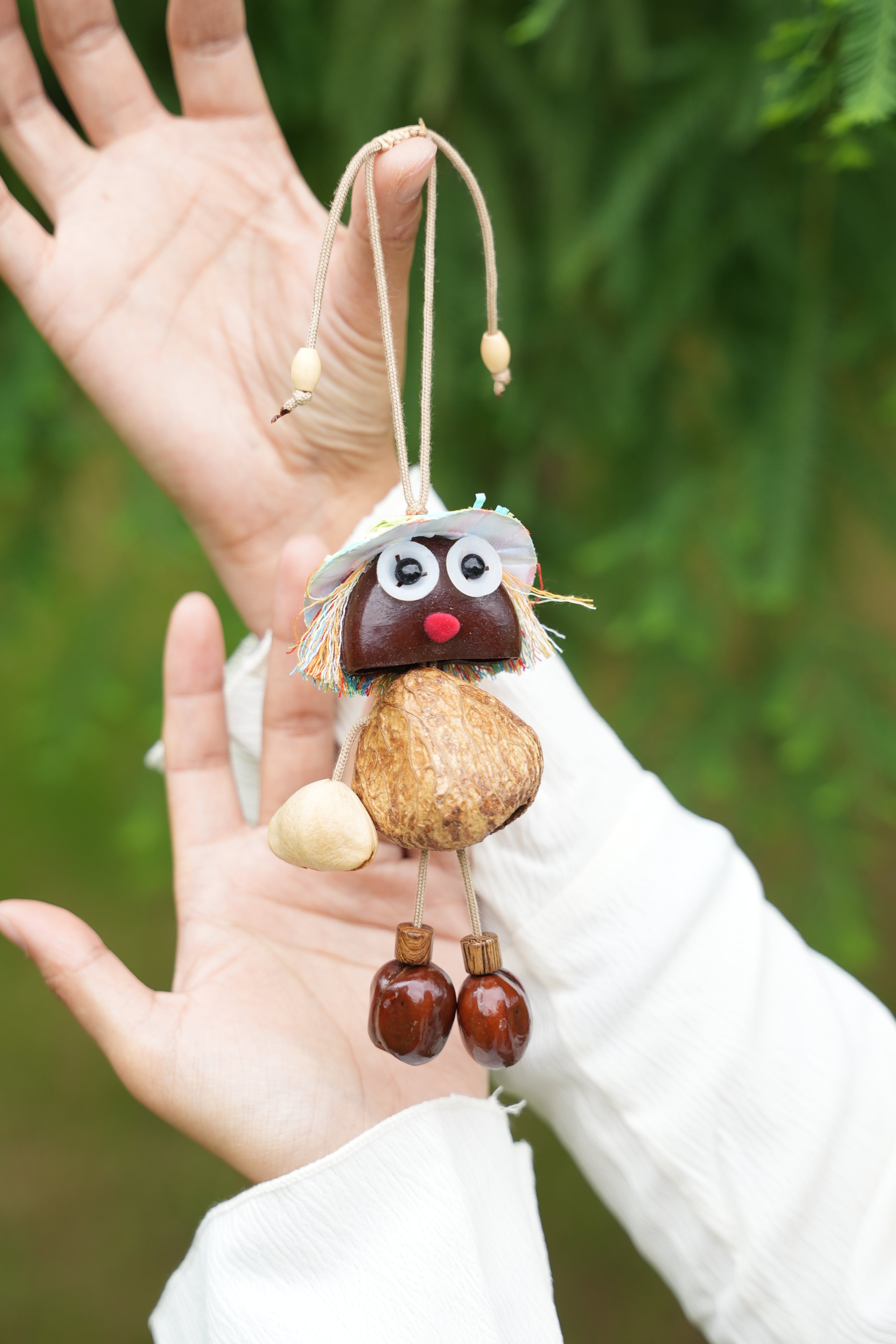 "The Seed Sprite" - Handcrafted Nut Shell Doll Charm with Colorful Fringe Hair