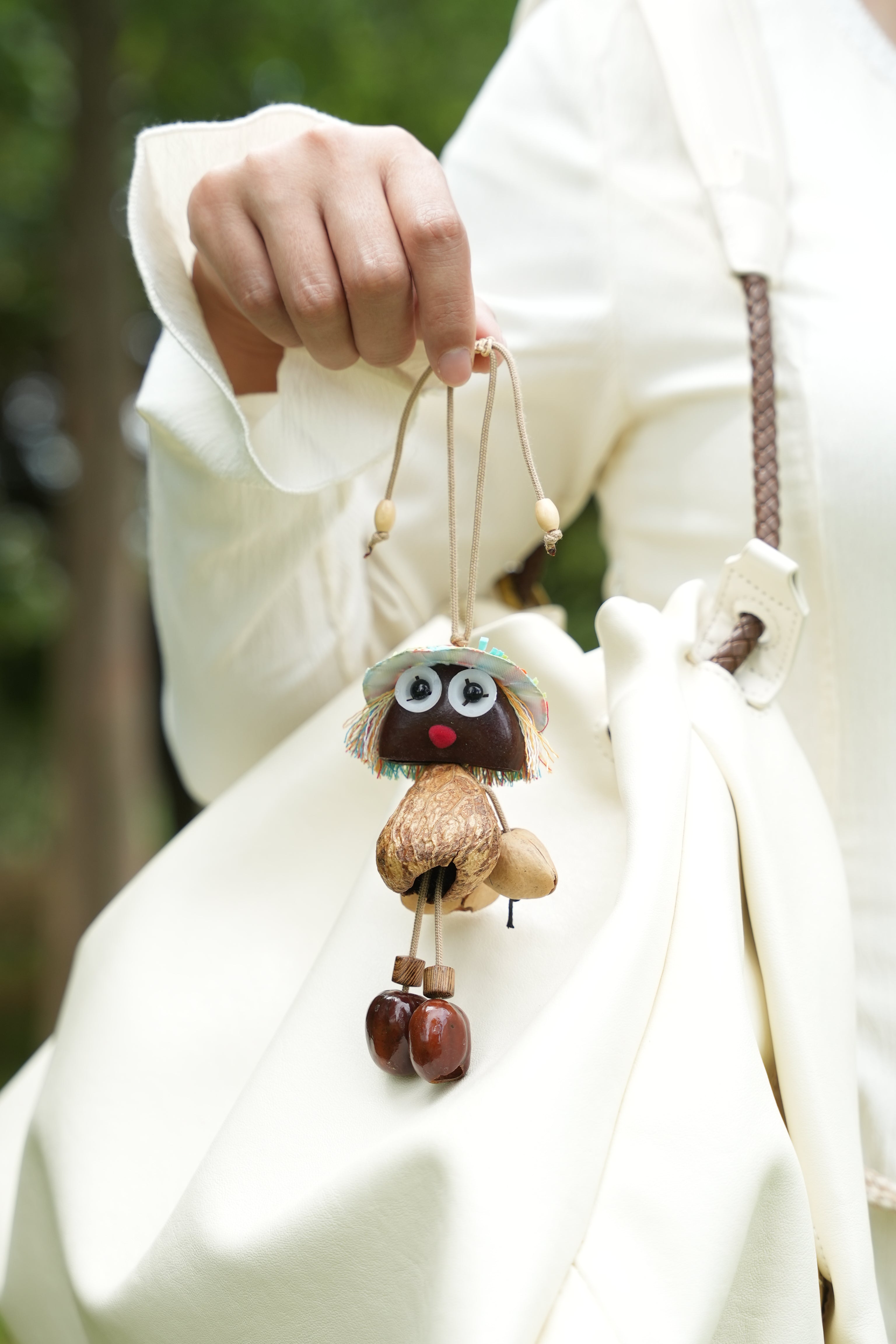 "The Seed Sprite" - Handcrafted Nut Shell Doll Charm with Colorful Fringe Hair