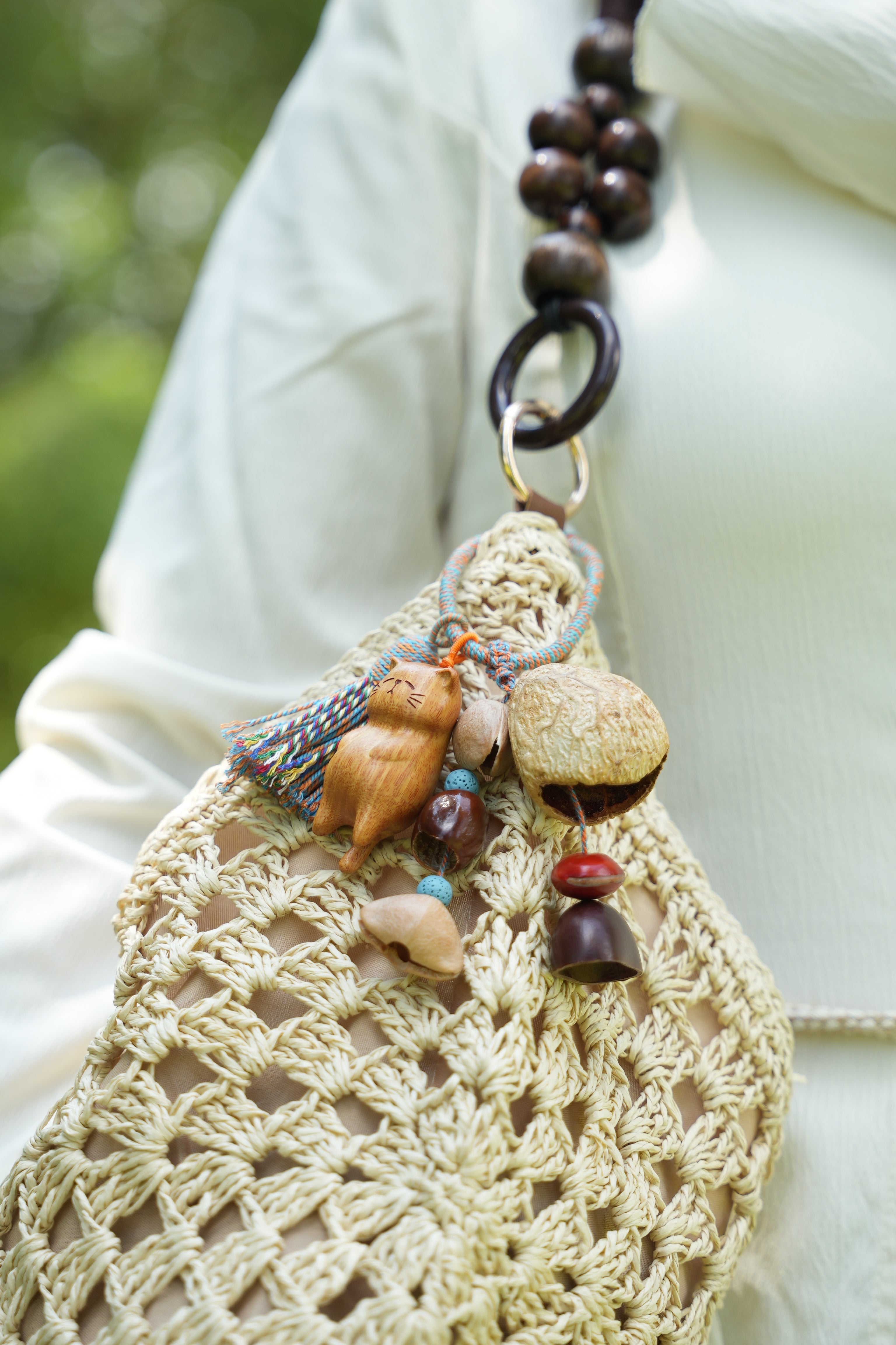"The Naptime Kitty" - Hand-Carved Wooden Cat Charm with Natural Seeds & Tassel