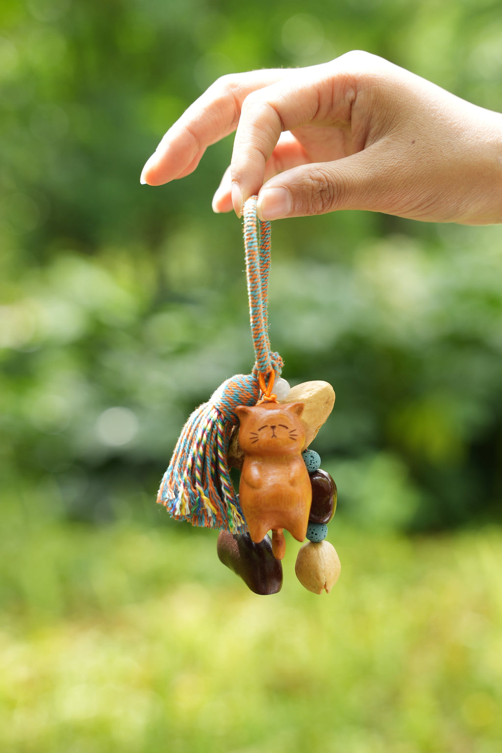 "The Naptime Kitty" - Hand-Carved Wooden Cat Charm with Natural Seeds & Tassel