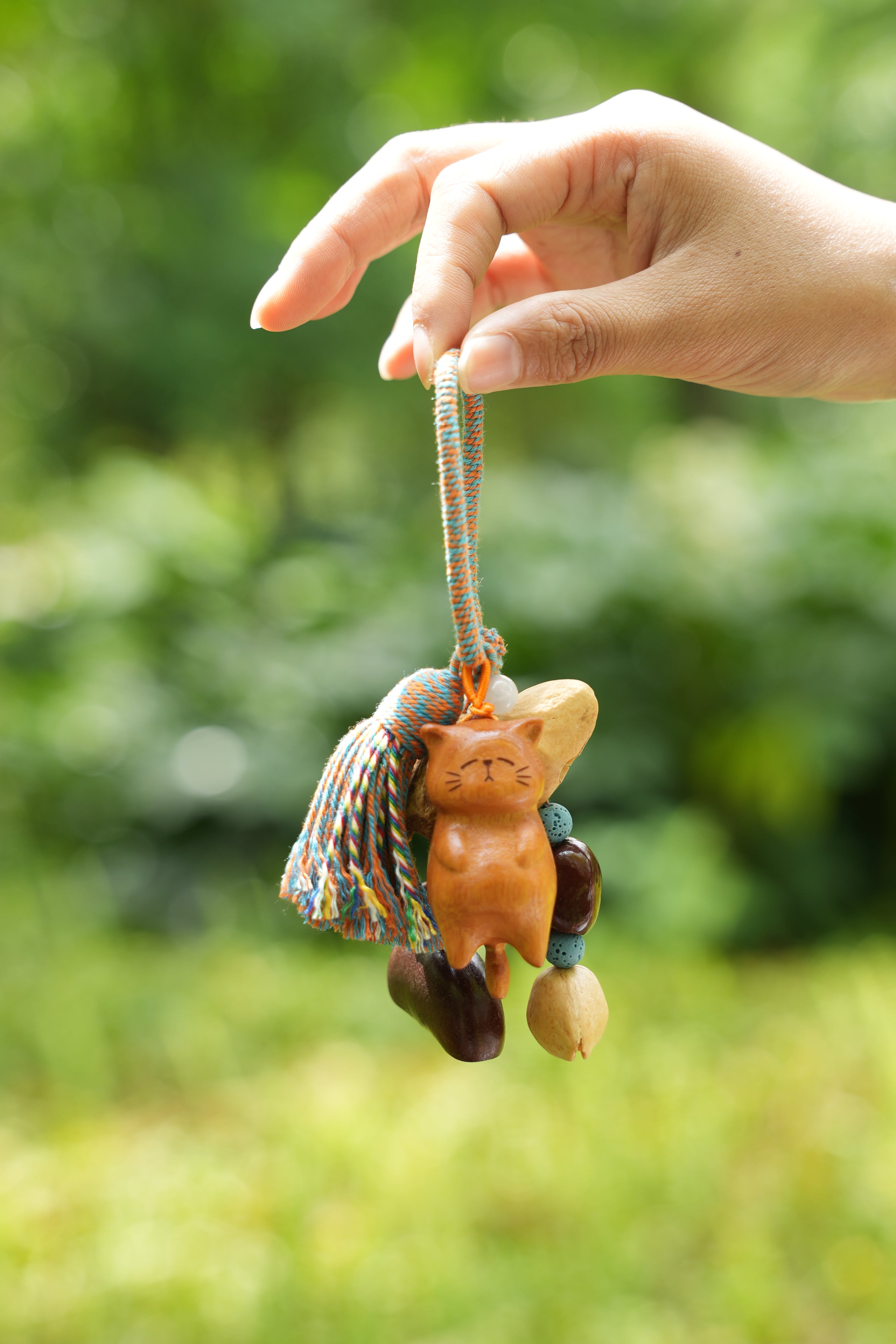 "The Naptime Kitty" - Hand-Carved Wooden Cat Charm with Natural Seeds & Tassel