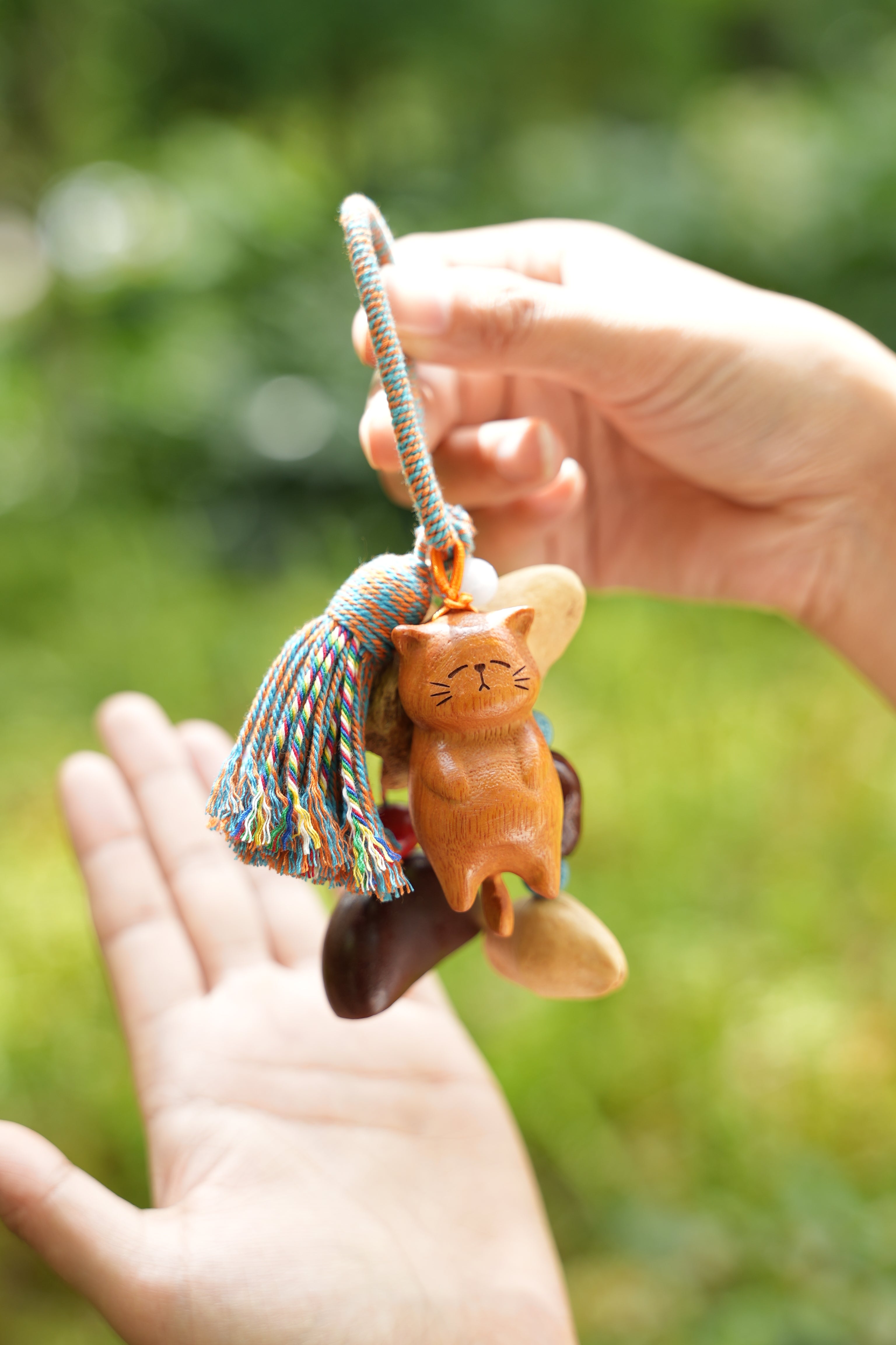 "The Naptime Kitty" - Hand-Carved Wooden Cat Charm with Natural Seeds & Tassel