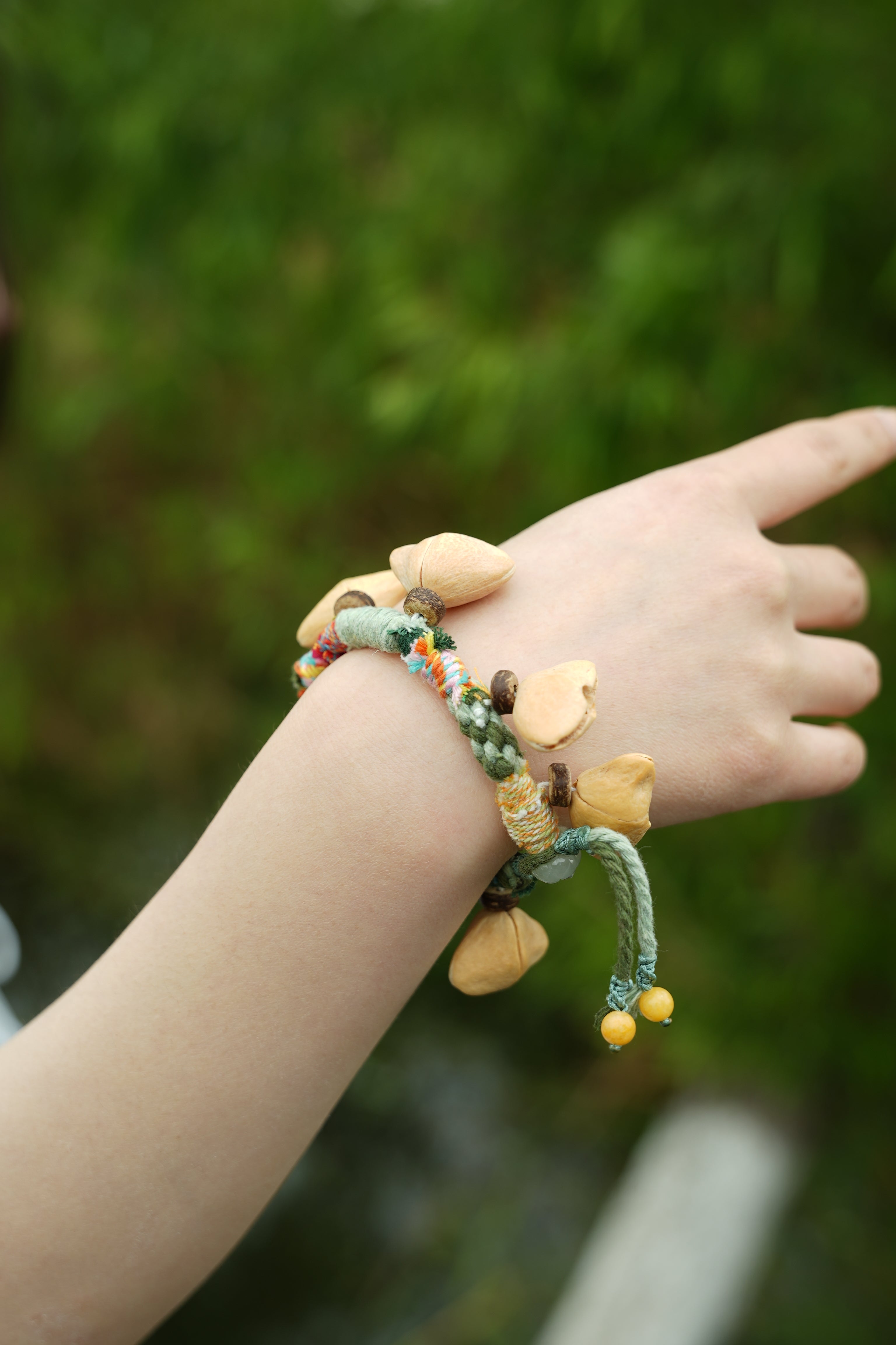 "The Happy Pistachio" - Hand-Braided Natural Shell Bracelet with Colorful Cord