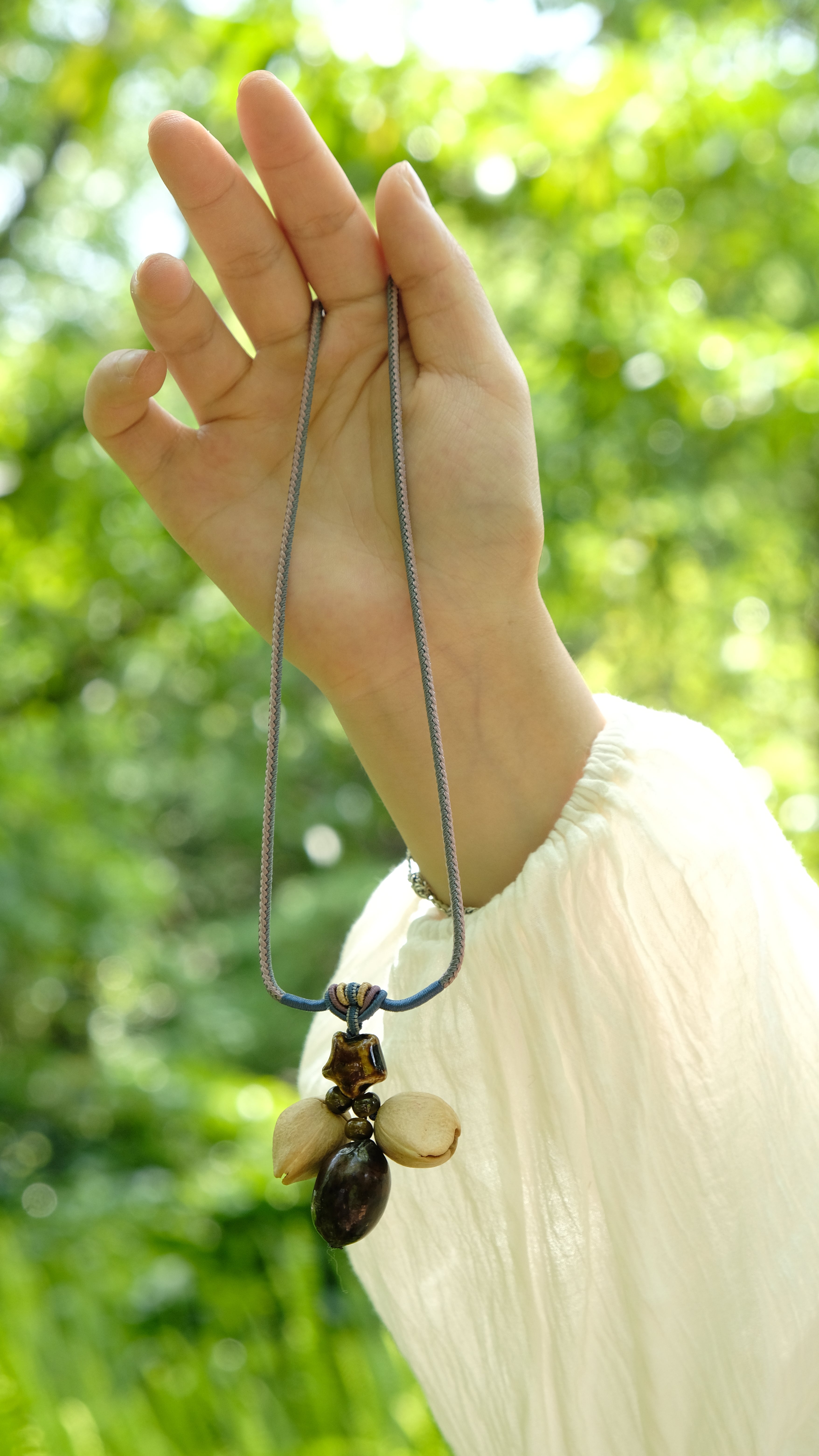 "The Guiding Star" - Natural Seed Pendant Necklace with Glazed Star Bead